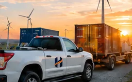 Service pickup truck and equipment containers at a wind farm